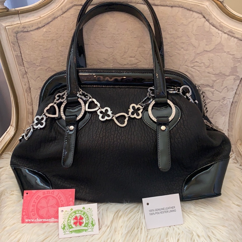 Charm and Luck black leather handbag , embossed grain design with patent trim